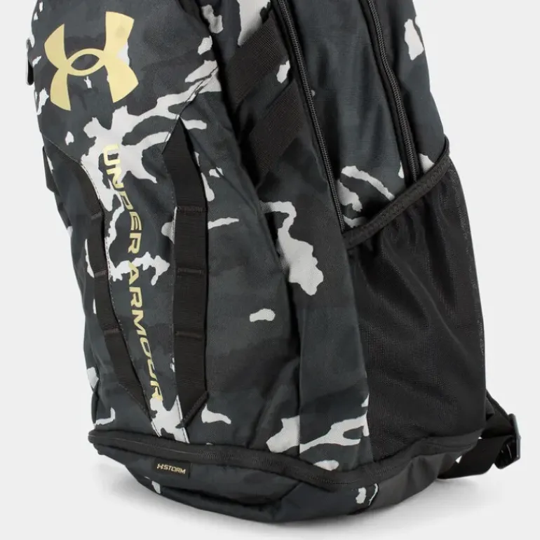 UA HUSTLE 5.0- ZAINI BLACK CAMO GOLD 1361176